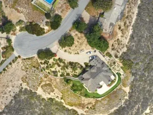 Aerial study of a hillside estate and its site plan
