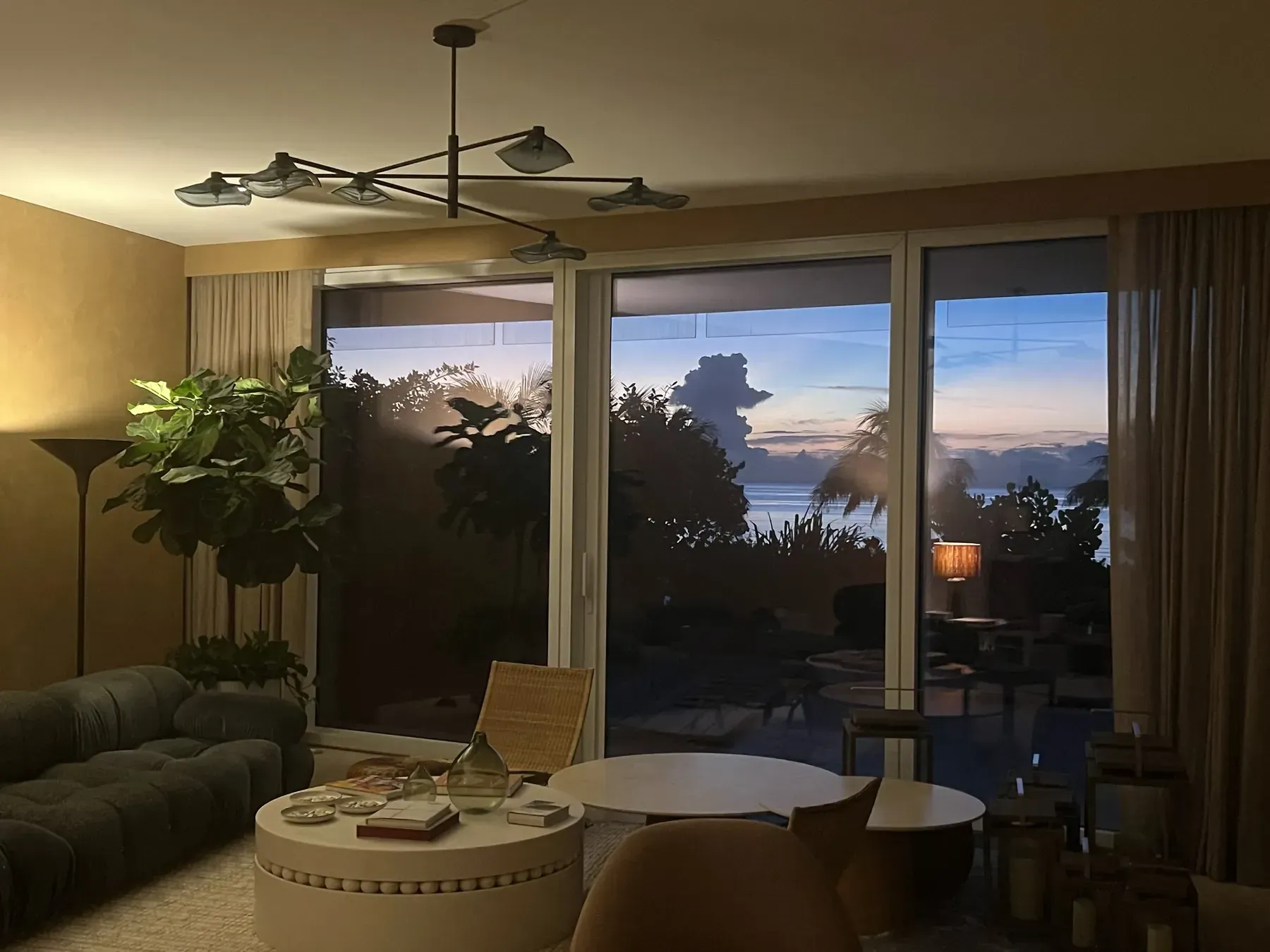 High-rise living room opening to an ocean view