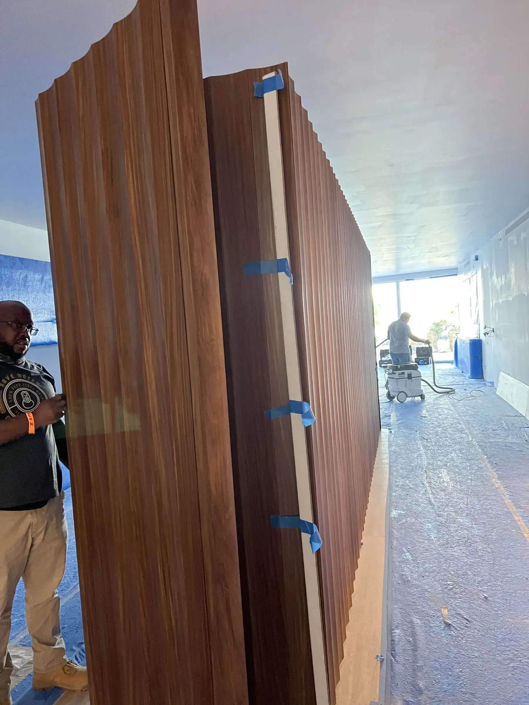 Bespoke millwork and sculpted paneling in rare South American wood